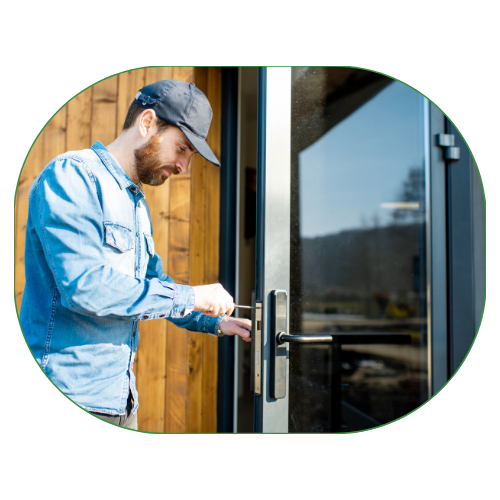 Technician installing a handle on a glass door